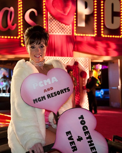 At the opening reception for the Professional Convention Management Association conference in Las Vegas, a fur-clad showgirl greeted attendees from atop a vintage Cadillac convertible.