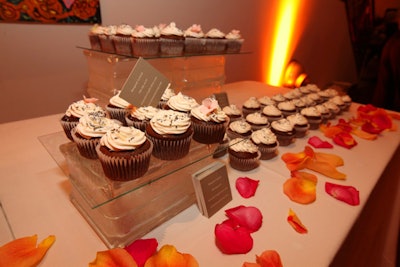 Le Royale Icing provided cupcakes topped with pink sugar flowers and silver sprinkles.