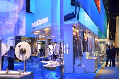 Delta Faucet Company used cool blue lighting and running water to draw attendees to its large display of bath and kitchen fixtures.