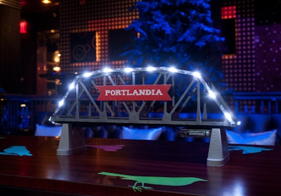 Illuminated bridgelike structures served as centerpieces for the communal tables, playing up Portland's 'Bridge City' nickname.