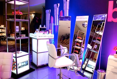 Inside Access Hollywood's fifth annual “Stuff You Must …” lounge at the Sofitel for the Globes, produced by On 3 Productions, Jes Gordon Proper Fun designed a salon-style space for CVS, with pink and orange callas, decorative rocks scattered among the products, and logos displayed in mirrored frames.