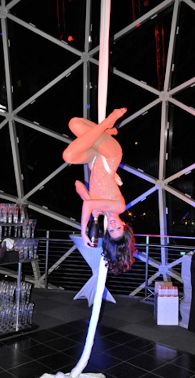An aerial performer drew guests to the third floor for a glass of champagne.