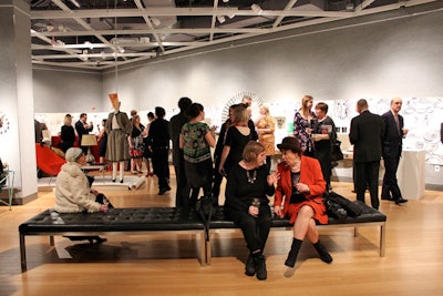 Styled as a cocktail reception, the event displayed the silent-auction items around the perimeter of the room, with a few benches for sitting in the center.