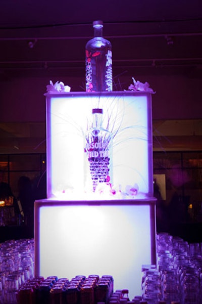 An oversize bottle and glowing Lucite cubes decorated the central bar, where bartenders served drinks such as Wild Tea gimlets.