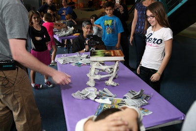 Museum staff used textbooks to judge the strength of the paper-and-tape tables.