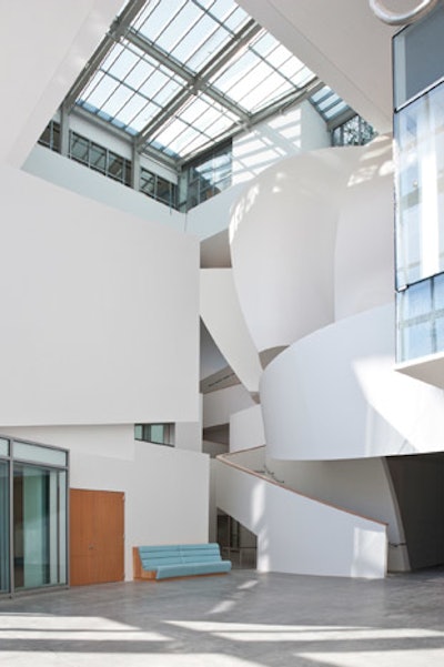 The six-story, skylit atrium is filled with geometric forms designed by architect Frank Gehry.
