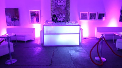AFR Event Furnishings provided two illuminated bars in the main event space and an additional L-shaped one at the entrance.