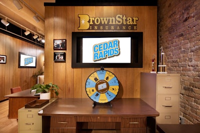 A prize wheel lets guests win items such as branded lip balm, vests, and pens. In Cedar Rapids, the main character's name is Tim Lippe; the souvenir lip balm is thus branded 'Lippe Balm.'