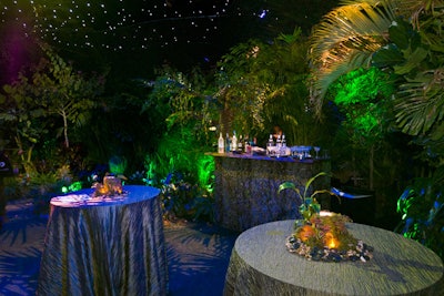 Decorators covered a wood bar with moss and vines and high-top cocktail tables with moss Fortuny satin linens.