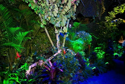 Performers camouflaged as plants hid among the foliage.