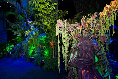 Near the bar, a performer camouflaged as a weeping willow tree blended into the decor.
