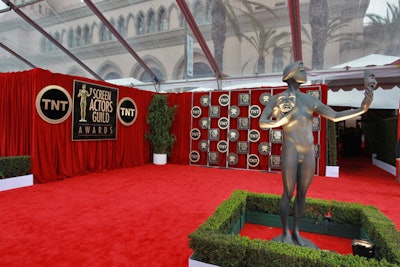 Outside for arrivals, 585 feet of hedging edged close to the wide red carpet, and 300 fans were accommodated in bleacher seating.