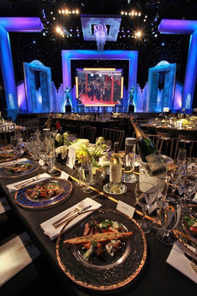 More than 3,600 gold-rim champagne, wine, and water glasses topped 86 rectangular dinner tables, covered with black silk and gold satin ribbon as a top-stitched detail.