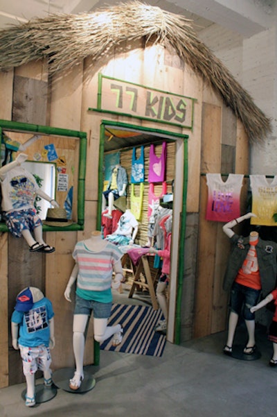 To house American Eagle Outfitter's year-old kids line, 77Kids, de la Cruz constructed a weathered hut, topped with a thatched roof.