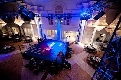 A full-size boxing ring set up beneath the venue's hanging chandeliers made for an interesting contrast.