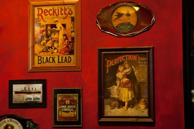 Framed vintage posters line the walls.