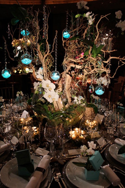 Tiffany & Company's table by Richard Lambertson and David M. Handy Event Design & Planning had a woodsy look, contrasted with strands of crystals and LED-lit globes in the jewelry company's signature turquoise. Handy described it as 'walking in the woods and stumbling upon a New York penthouse.'