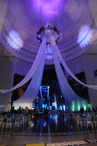 After strolling through the buffet stations, guests found unassigned seating in the museum's rotunda and surrounding areas. Ivan Carlson & Associates handled decor.