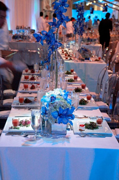 Three different styles of centerpieces decorated the tables, each with cymbidium orchids that had been injected with blue.