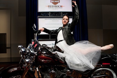 A member of the Nevada Ballet Theatre posed with a Harley-Davidson motorcycle, which was a lot in the evening's live auction.