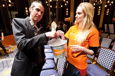 After a 'speed giving' session, Youth Design interns walked around collecting donations in paint buckets.