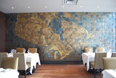 Unit Five's sheet-metal installation map of Canada covers the back wall of the private dining area.