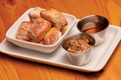 The menu includes house-made soft pretzels with whole-grain mustard and orange-blossom honey.
