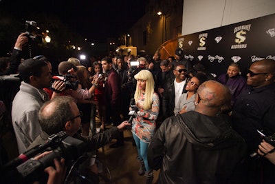 Nicki Minaj and other artists posed on the gold carpet.