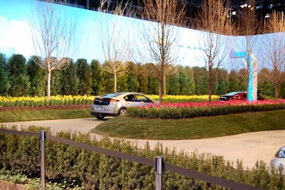 The test track for the Chevrolet Volt, an electric car, was lined with trees and tulips that underscored the vehicle's earth-friendly properties. The smell of fresh flowers surrounded the track.