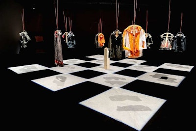 A checkerboard-style installation marked the Christopher Raeburn for Victorinox presentation inside Eyebeam's raw space on February 10. Rather than models, the show used crossbow-shaped hangers to display the clothes from the fall 2011 collection.