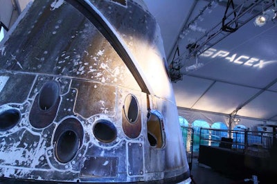 SpaceX showcased its Dragon capsule, the first commercial space capsule to be launched into orbit and return safely to the U.S., for guests to check out.