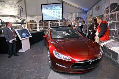 A promotional video of the new sedan ran on a projection screen behind the alpha build and design prototype of the car.
