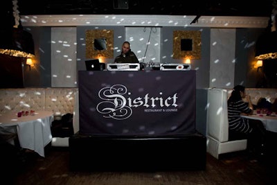 District branding adorned the DJ booth, which DJ Tanno manned for the night.
