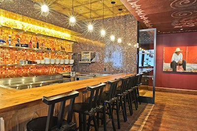 The so-called 'kitchen counter' area offers an informal seating area for eight.