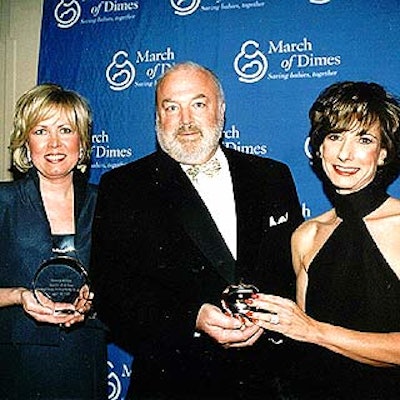 Honorees Deborah Walters of Saks Fifth Avenue (left) and Camille McDonald of Parfumes Givenchy posed with Beauty Ball chairman Lawrence Aiken. (Photo by Al Periera)