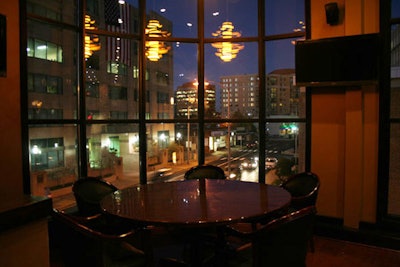 The dining room has floor-to-ceiling windows with views of Arlington.