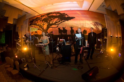 Designers used a silhouetted safari scene as the backdrop for the band.