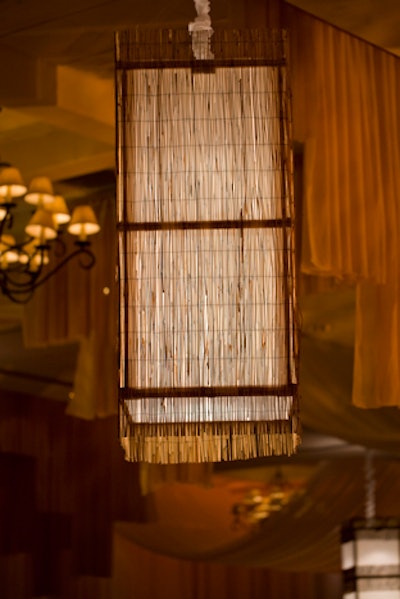 Conceptbait created 10 custom chandeliers, each four feet tall and two feet wide, covered in mini bamboo and matte fabric to add texture to the decor.
