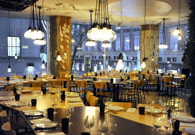 In lieu of a show at the tents, and to allow its new creative director time to transition into the role, Lacoste opted to host a 40-person dinner at its Fifth Avenue store. To dress the space, currently under renovation, the apparel company installed a stained and varnished plywood table for the evening and left the construction's exposed ceilings and wires in place.