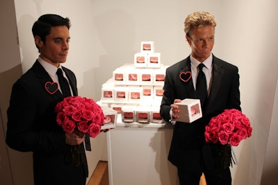 As guests departed Christie's, male models bearing rose bouquets handed out custom Barbie-theme cupcakes from Magnolia Bakery.