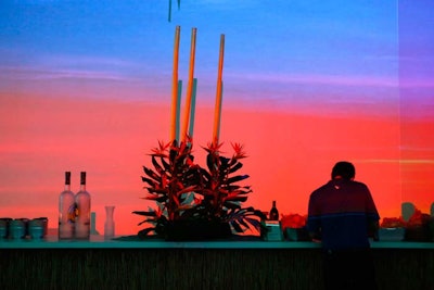 A sunset projection lit up a bar serving Grey Goose Vodka cocktails.