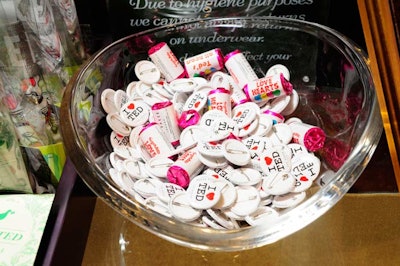 Guests could scoop up small branded gifts from a bowl of heart-shaped candy and 'I Love Ted' pins.