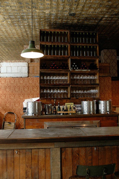 Vintage elements are incorporated into the decor at the winery, with reclaimed barn wood, wallpaper from the 1940s, and midcentury industrial lighting.