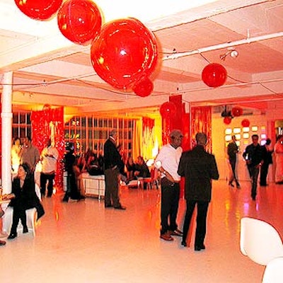 The main area was scattered with chrome and white couches and 60's chairs at cocktail tables. Plastic red globes hung from the ceiling.