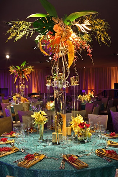 Mark Held of Mark's Garden designed the Governors Ball flowers, going for a combination of tropical blooms, orchids, and succulents, all highlighted with feathers and metallic accents for a splashy look. Bright linens came from Resource One and the rentals from Classic Party Rentals.