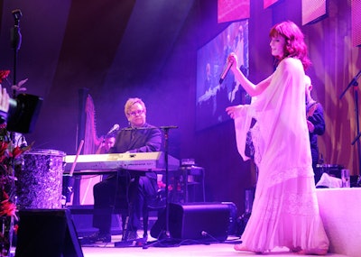 At the Elton John AIDS Foundation party, singer Florence Welch performed with her band, Florence and the Machine, and with party host Elton John.