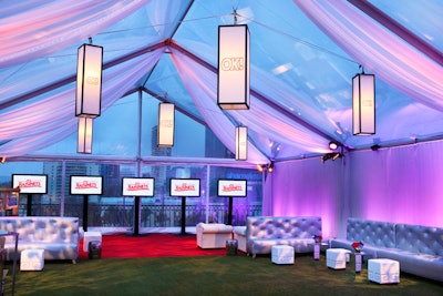 Tufted furnishings and white ottomans lent a clean look under the clear tent at OK!'s party.