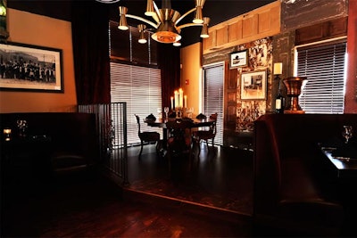 A raised platform in one corner of the main room has an antique dining table with seating for six.