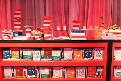 Shelves filled with iconic Dr. Seuss books like The Cat in the Hat and Green Eggs and Ham and topped with breakfast treats from Creative Edge Parties served as the base of the two buffet bars inside the forum.