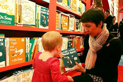 A ceiling-high shelf sat at the entrance to the Celeste Bartos Forum and guests were encouraged to browse the selection of books.